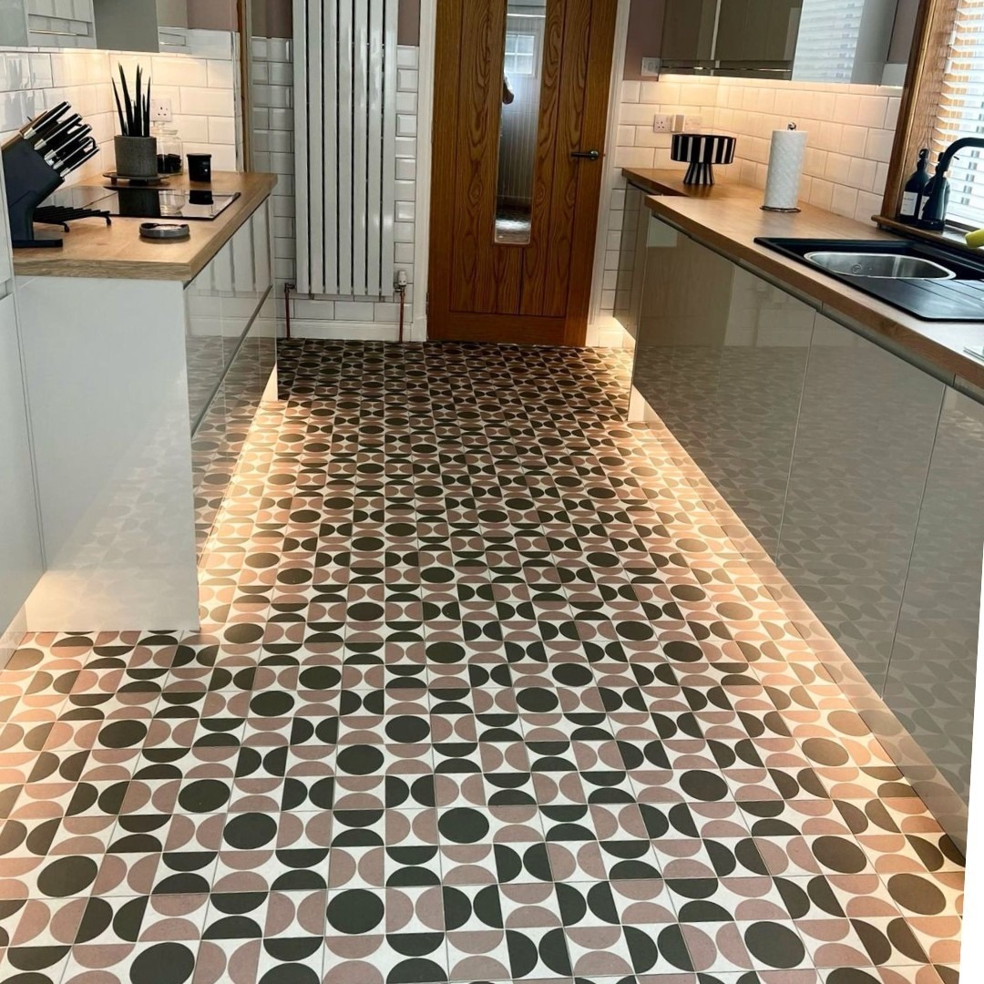 Retro circle-pattern cushioned vinyl flooring fitted in a galley kitchen