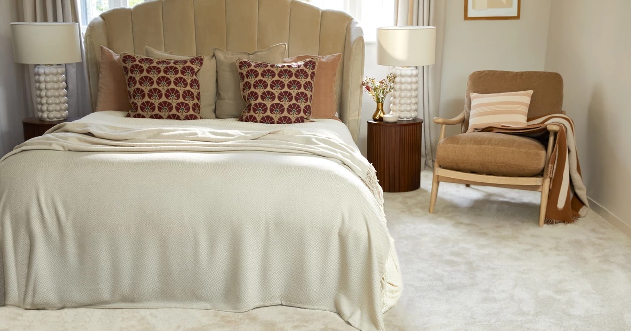 Velvety cream bedroom carpet styled with a velvet bed and reading chair