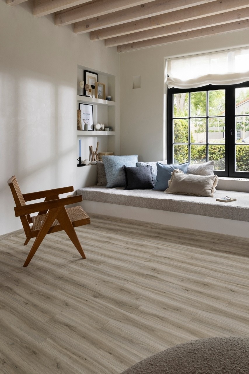 Wide-plank wood-look LVT flooring in a bay-window snug